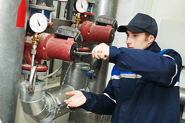 Image showing heating engineer repairman in boiler room