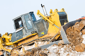 Image showing bulldozer loader at winter frozen soil excavation works