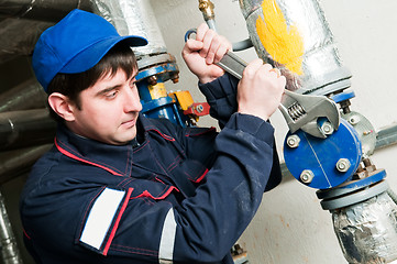 Image showing maintenance engineer in boiler room