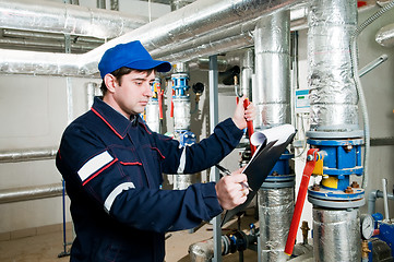 Image showing heating engineer in boiler room