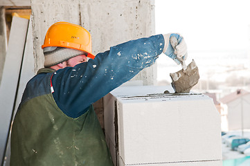 Image showing worker mason at bricklaying work