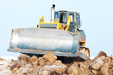 Image showing bulldozer loader at winter frozen soil excavation works