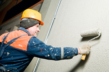 Image showing builder plastering facade wall