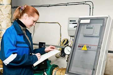 Image showing woman engineer in a boiler room