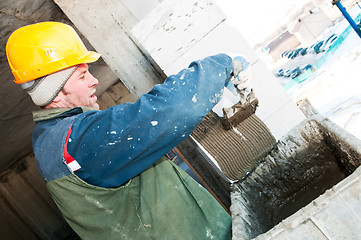 Image showing builder mason at bricklaying work