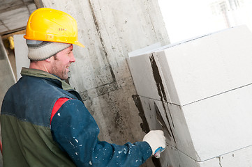 Image showing builder mason at bricklaying work