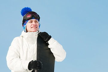 Image showing Happy sportsman with snowboards