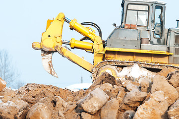 Image showing bulldozer loader at winter frozen soil excavation works