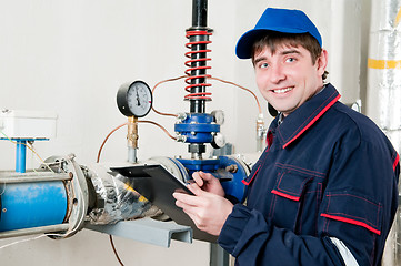 Image showing heating engineer in boiler room