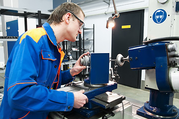 Image showing worker at machine tool operating