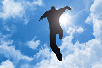Image showing bright sun man jumping