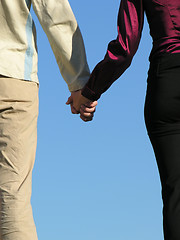 Image showing man & woman holding hands  