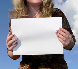 Image showing woman holding a white card