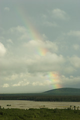 Image showing Rainbow through clouds