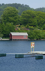 Image showing Boathouse and lifesaving ring