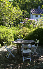 Image showing Chairs and table in a garden