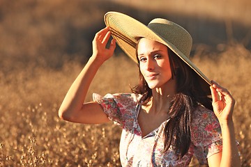 Image showing Young Beautiful Woman on a Field in Summer Time