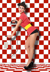 Image showing Pin Up Girl of the 1950 Era With Iron