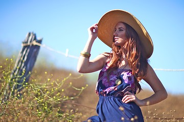 Image showing Young Beautiful Woman on a Field in Summer Time