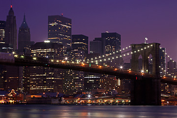 Image showing Brooklyn Bridge and Manhattan Skyline At Night NYC