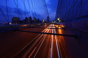 Image showing Brooklyn Bridge and Manhattan Skyline At Night NYC