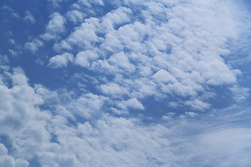 Image showing Fluffy clouds in the blue sky