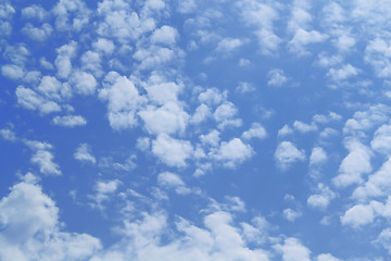 Image showing Fluffy clouds in the blue sky