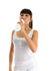 Image showing Fitness girl drinking water