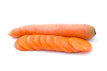 Image showing Ripe fresh long carrot and some slices