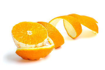 Image showing Orange slice and some spiral-shaped peel