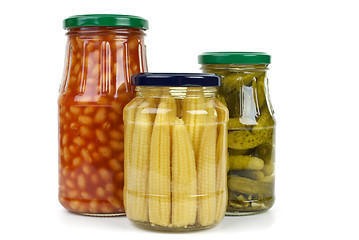 Image showing Glas jars with cornichons, haricot beans and corn ears