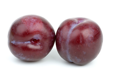 Image showing Two violet plums