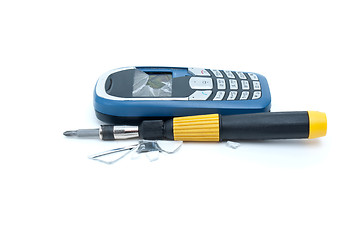 Image showing Broken cellular phone and screwdriver