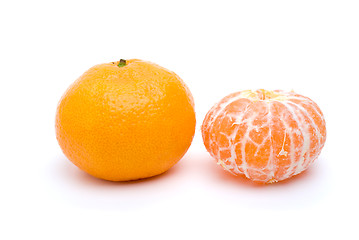 Image showing Whole and peeled tangerine