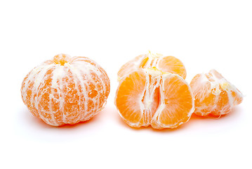 Image showing Peeled tangerine and some segments