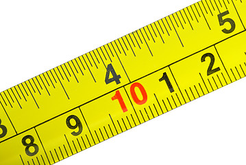 Image showing Close-up shot of yellow metal measurement tape