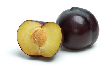 Image showing Whole plum and half