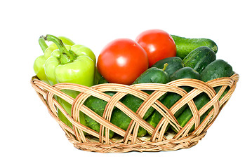 Image showing Basket with some cucumbers, tomatoes and sweet peppers