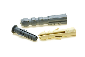 Image showing Three plastic dowels