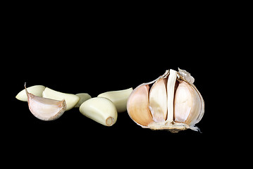 Image showing Half of garlic bulb and cloves