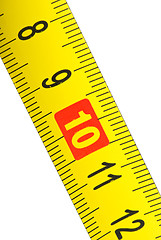 Image showing Close-up shot of yellow metal measurement tape