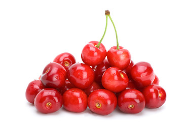 Image showing Pile of red cherries without stalks and pair berries on the top
