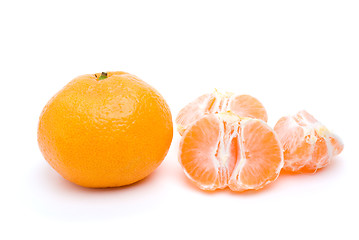 Image showing Whole tangerine and some segments