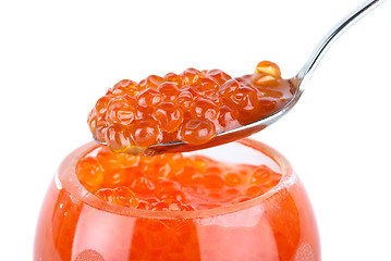 Image showing Close-up of metal spoon and glass bowl with red caviar