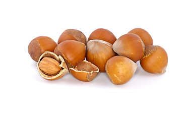 Image showing Small pile of hazelnuts and one cracked