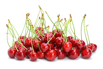 Image showing Small pile of red cherries with stalks