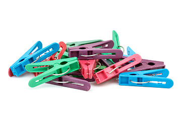 Image showing Pile of cheap plastic clotespins