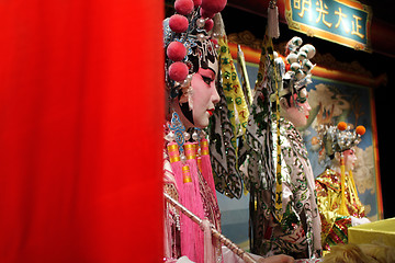 Image showing chinese opera dummy and red cloth as text space ,it is a toy,not