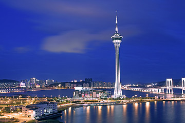 Image showing Urban landscape of Macau with famous traveling tower under sky n