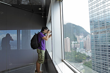 Image showing photographer takes a photo of the landscape indoor